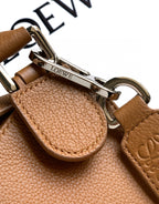 Tan leather bag hardware with silver-tone clasp and LOEWE logo plate