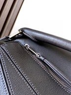 Loewe bag side panel detail with stitched seams and zipper track on dark leather