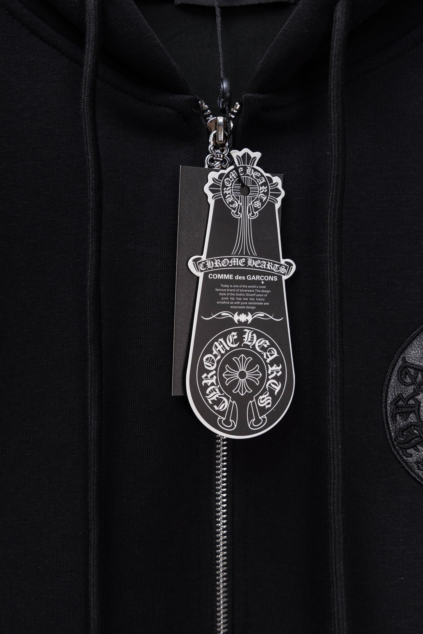 Chrome long black hoodie with keychain-style pendant and zip-front