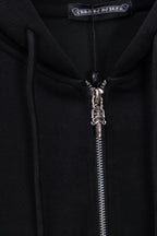 Black hoodie zipper with metal pull and small cross charm