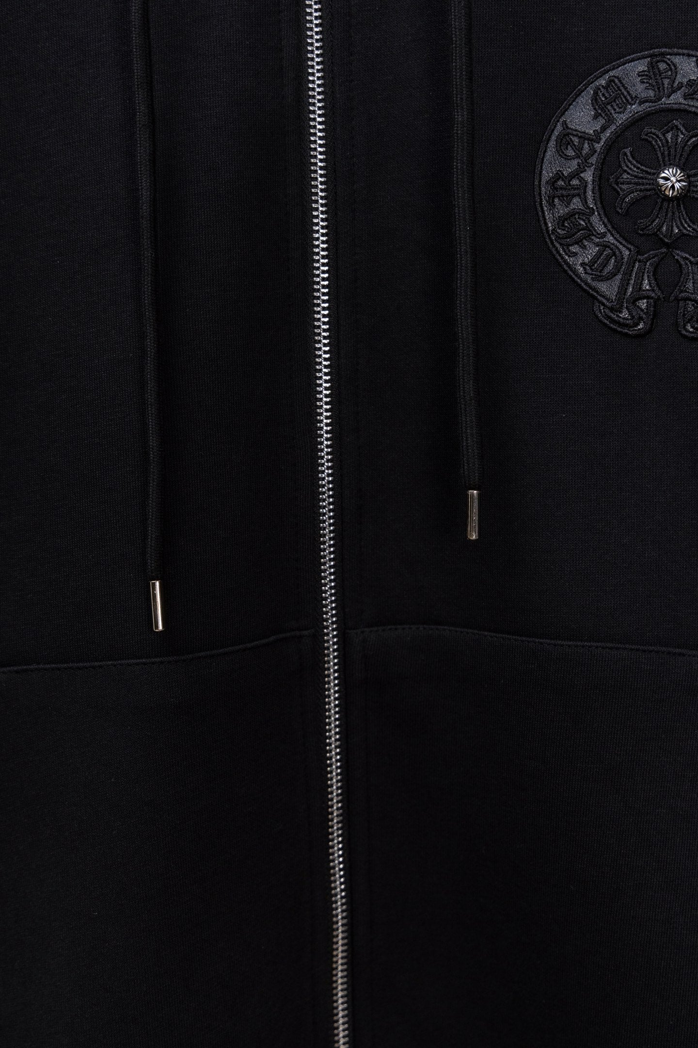 Black long zip hoodie with center zipper and two drawcord tips