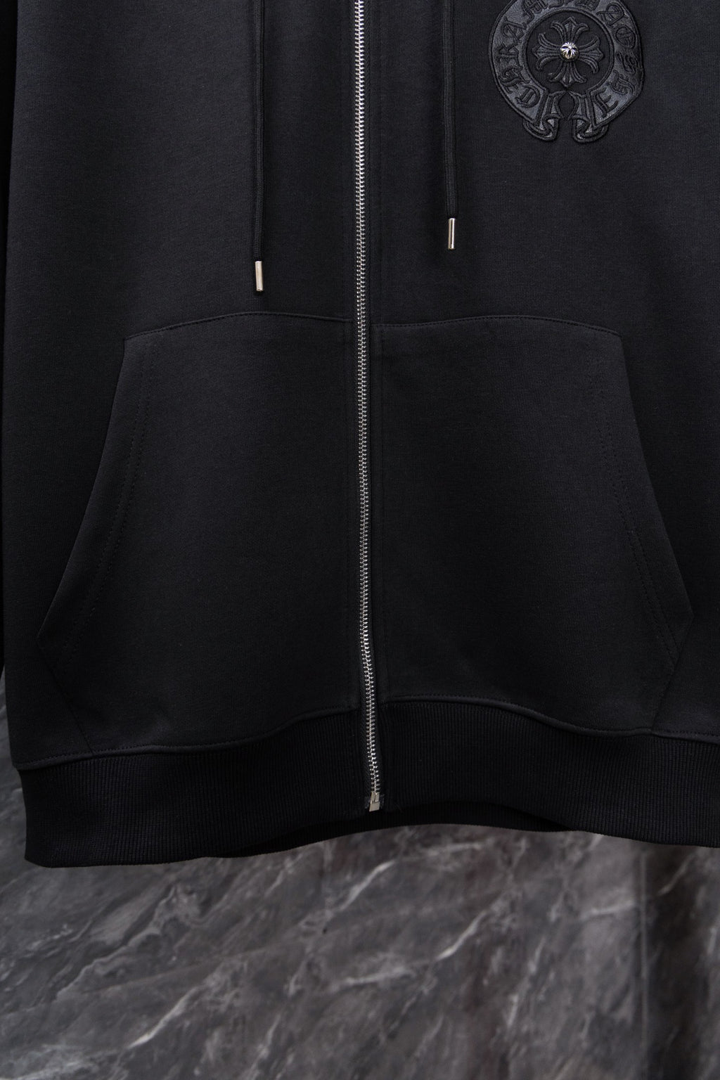 Chrome long black zip-up hoodie with side pocket and small cord tips