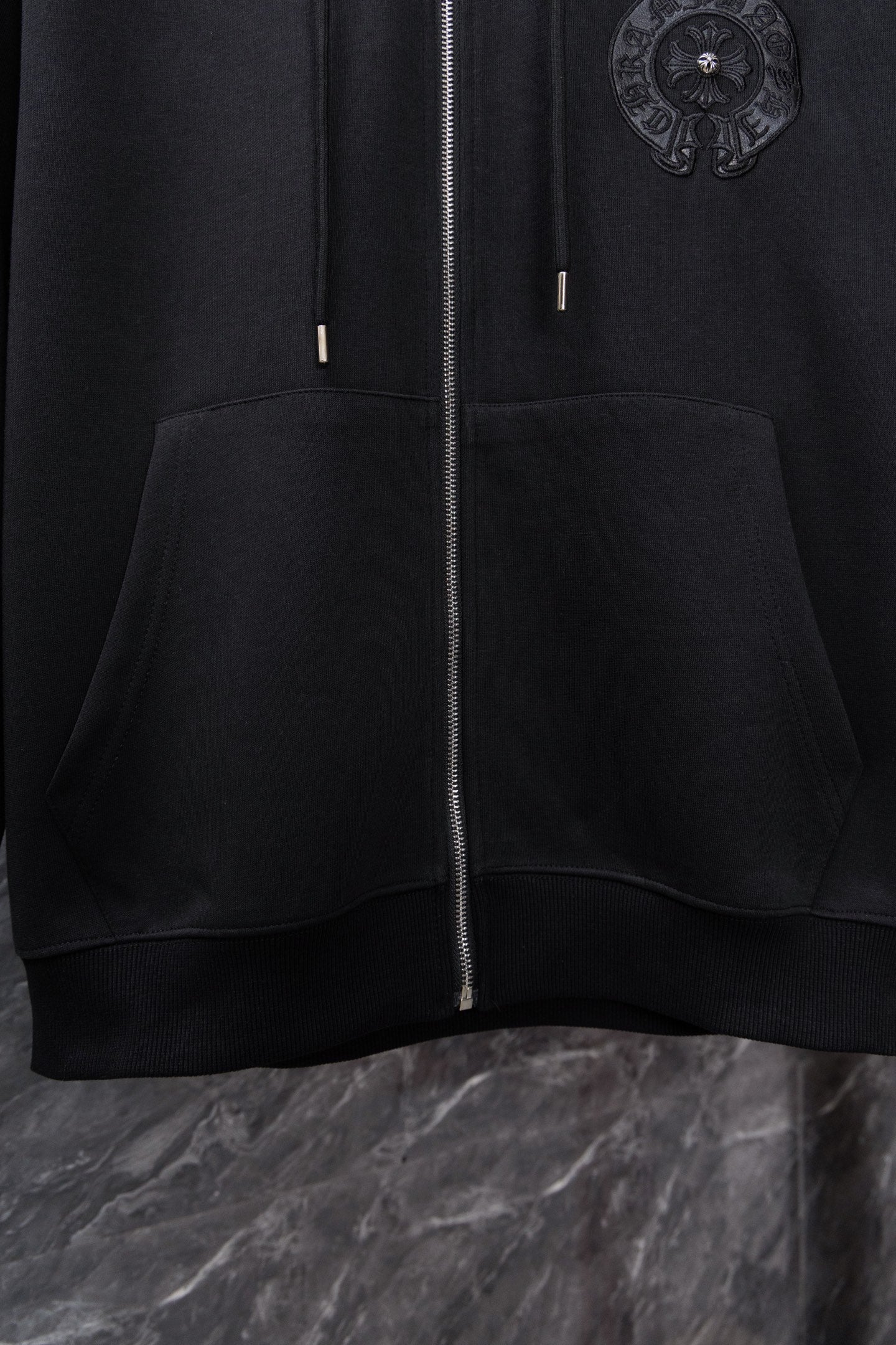 Chrome long black zip-up hoodie with side pocket and small cord tips