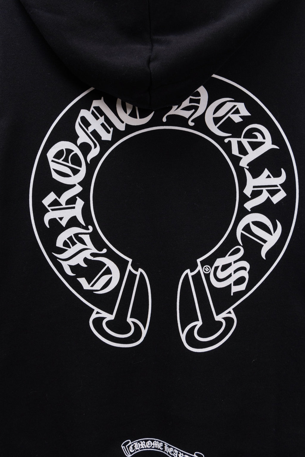 Black hoodie side seam with kangaroo pocket and ribbed hem