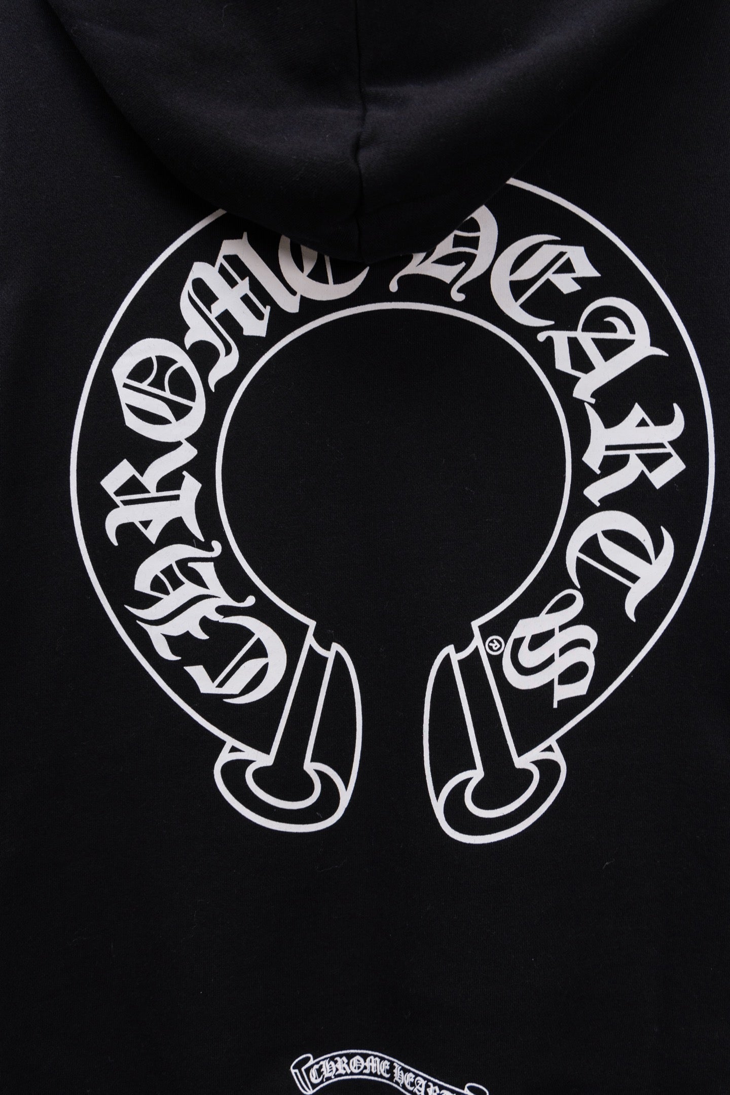 Black hoodie side seam with kangaroo pocket and ribbed hem