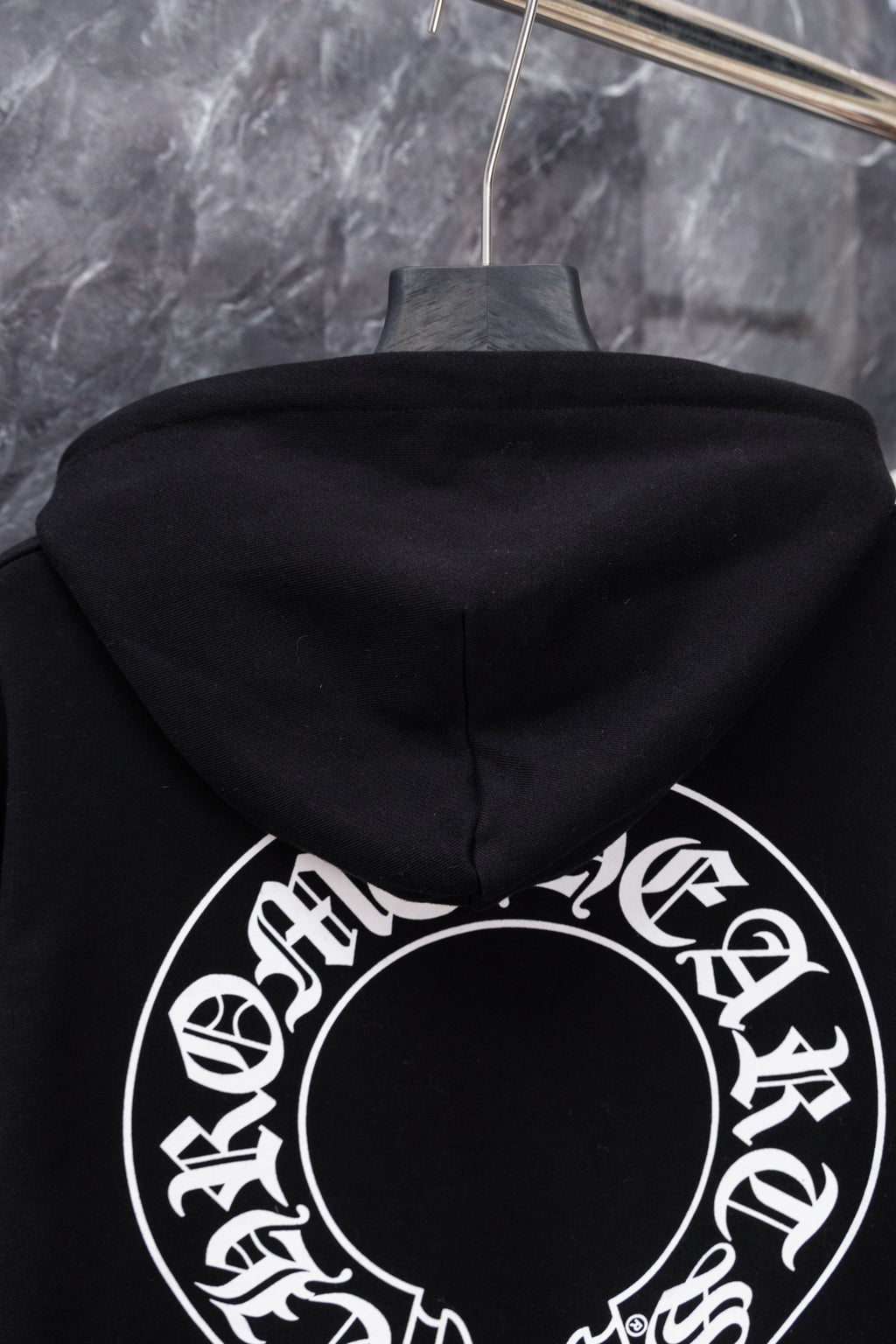 Black hoodie with large circular back graphic visible from hood