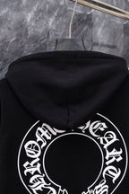 Black hoodie with large circular back graphic visible from hood