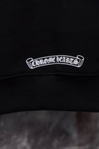 Black hoodie neckline with embroidered logo patch in white