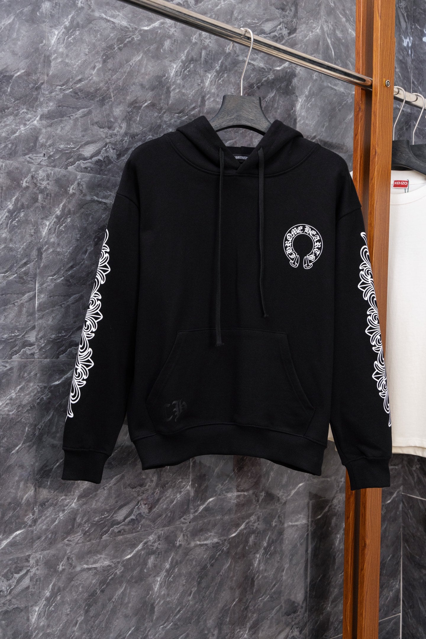 Black long-sleeve hoodie with front pocket and small left chest logo