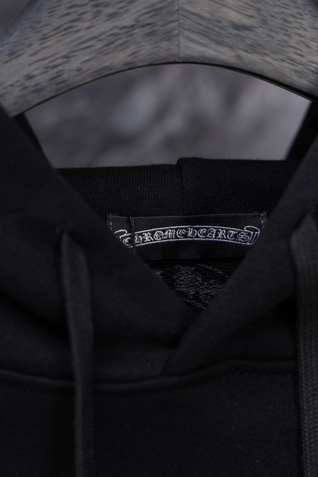 Black hoodie inner hood with woven brand label