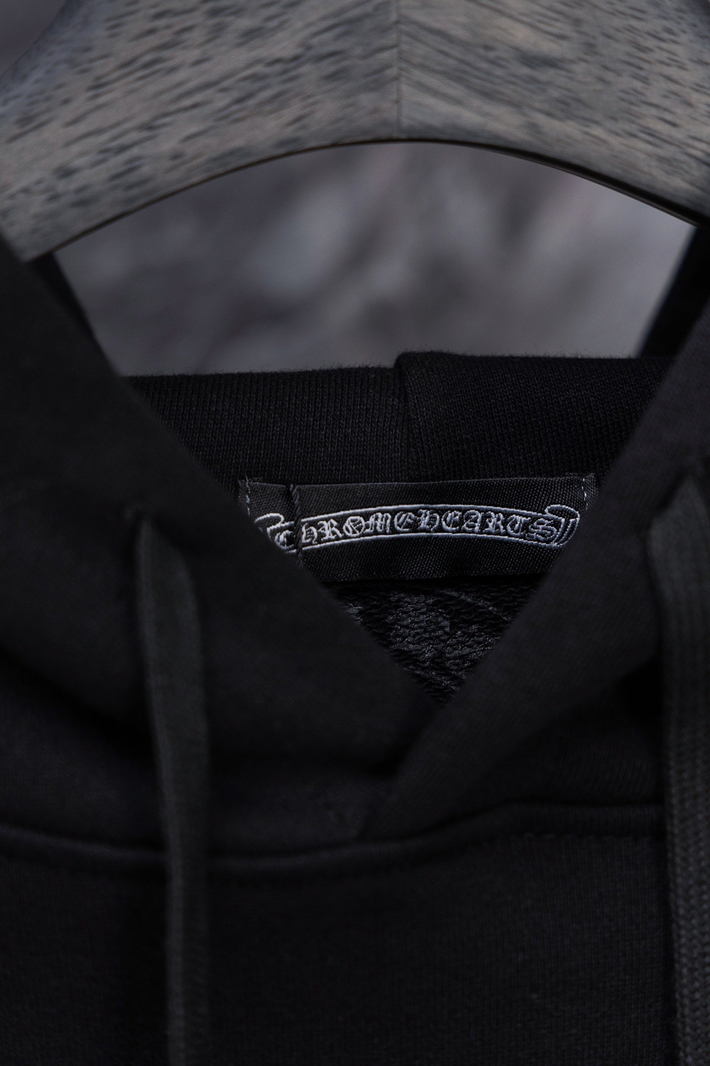 Black hoodie inner hood with woven brand label