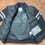 Long puffer jacket interior lining with tag and quilted dark blue shell