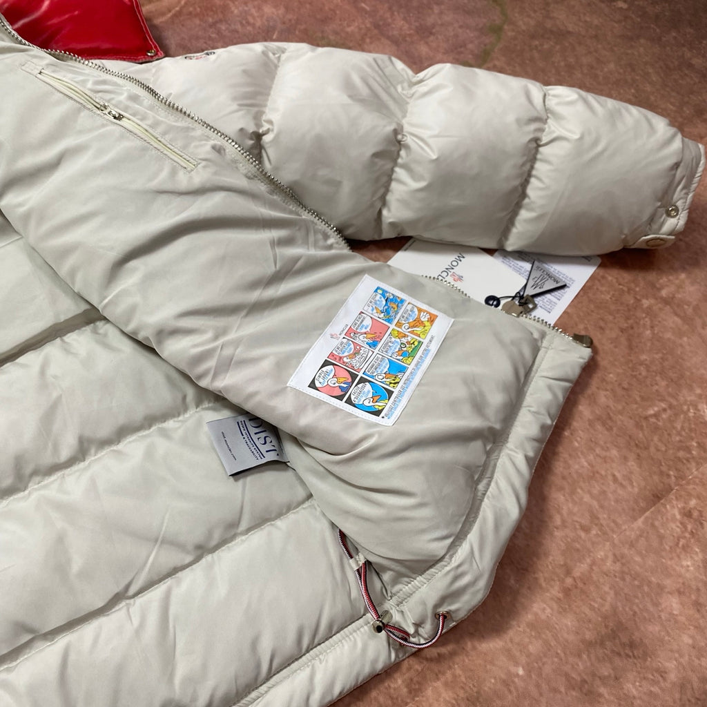 Moncler cream puffer jacket sleeve and hem with quilted padding and interior hang tags