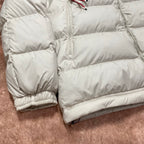 Moncler cream puffer jacket lower body with quilted panels and ribbed elastic cuffs