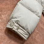 Moncler cream puffer jacket sleeve cuff with snap button and textured hem stitching