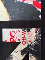 Black T-shirt fabric close-up with red Off-White™ text and circular logo