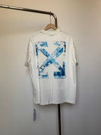 Off-white T-shirt with large blue 'X' graphic print