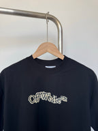 Dark crewneck T-shirt front with Off-White logo print, close view