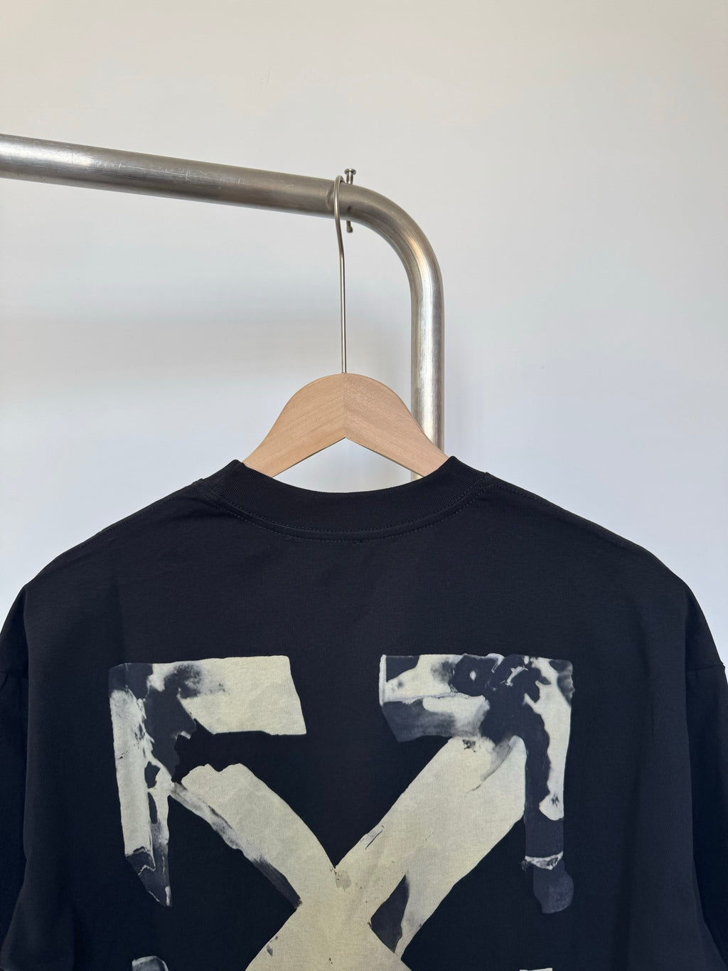 Dark crewneck T-shirt back view with large Off-White X graphic