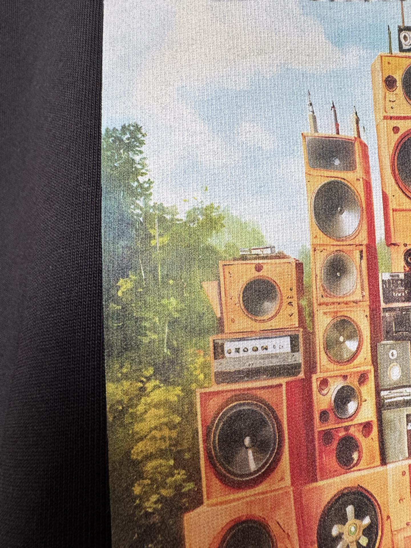Off White T-shirt graphic close-up with orange speaker tower