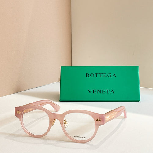 Bottega Veneta eyeglasses in light pink with gold patterned temples