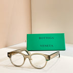 Eyeglasses with gray frames and gold patterned temple detail
