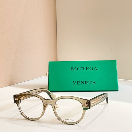 Eyeglasses with gray frames and gold patterned temple detail