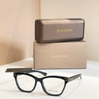 Eyeglass frames with black acetate temples and clear lenses, BVLGARI front logo.
