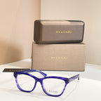 Eyeglass frames with bright blue acetate and clear lenses, BVLGARI front logo.