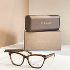 Eyeglass frames with dark brown acetate and clear lenses, BVLGARI front logo.