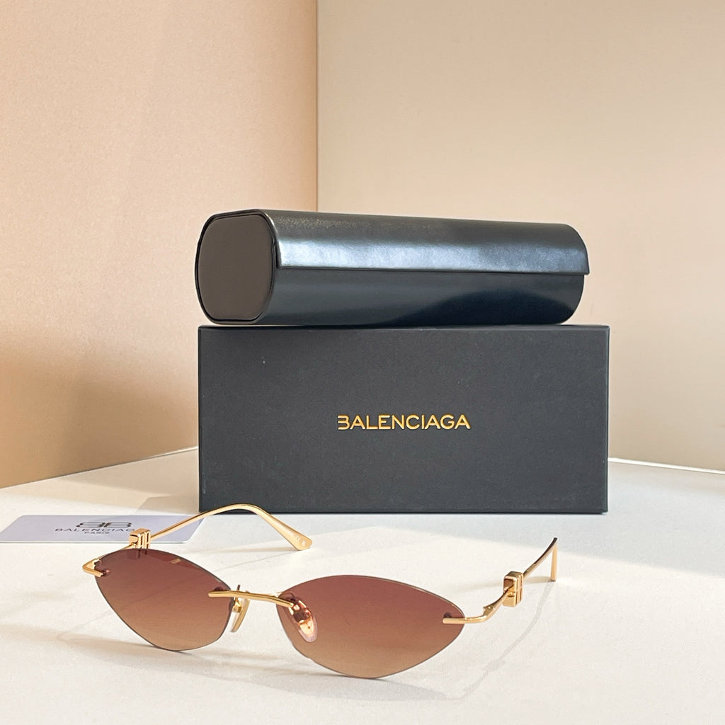 Balenciaga sunglasses with brown lenses and gold metal frame, metal temples