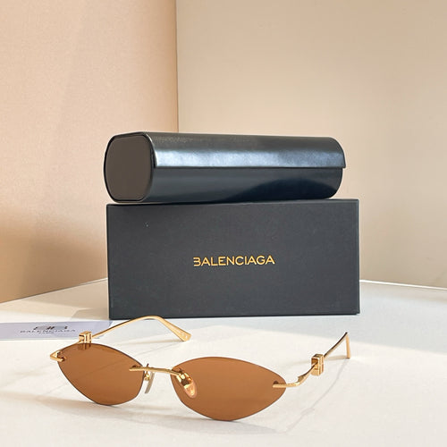 Balenciaga sunglasses with amber lenses and gold metal frame, metal temples
