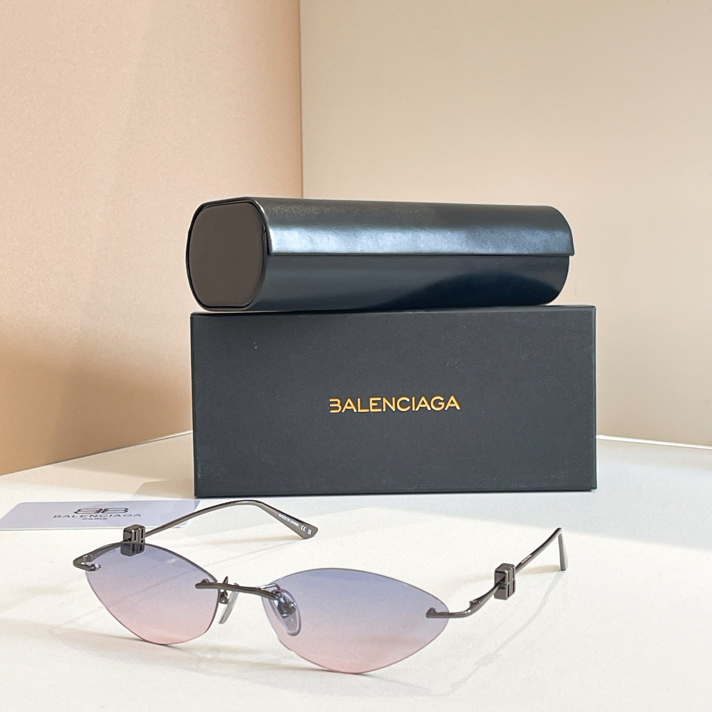Balenciaga sunglasses with light tinted lenses and silver metal frame, metal temples