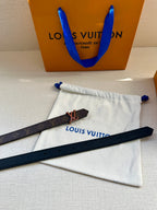 Louis Vuitton belt with monogram strap, V buckle, and dark keeper strap