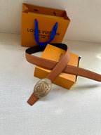 Louis Vuitton belt with cognac strap and gold-tone oval logo buckle with dark strap