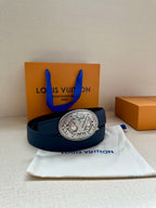 Navy leather belt with large oval silver buckle, laid across white dust bag