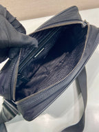 Dark blue crossbody bag open with zipper pocket and fabric lining