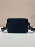 Dark blue rectangular shoulder bag with top handle and side crossbody straps