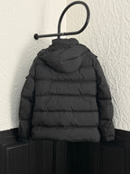 Long black puffer jacket with hood and back yoke seams