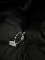 Black puffer jacket zipper with fabric tab and pull loop