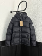 Long black puffer jacket with hood, front buttons, and drawcord collar