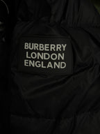 Black puffer jacket with “BURBERRY LONDON ENGLAND” label patch