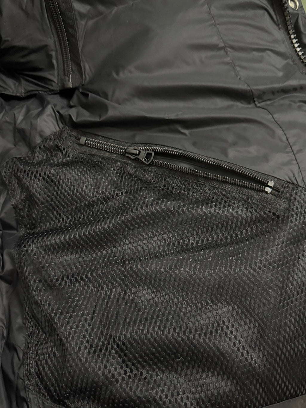 Black puffer interior with mesh pocket and zipper closure