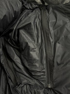 Black puffer jacket interior with long zipper and padded lining