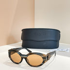 Versace round sunglasses with tortoiseshell frames and tan tinted lenses
