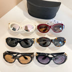 Set of Versace sunglasses in assorted frames: white, red, black, and tortoiseshell