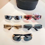 Multiple sunglasses in blue, red, and gold tones with black case