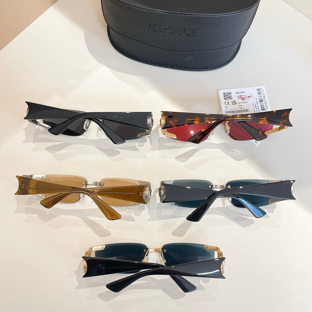 Flat lay of mixed-tone sunglasses with black case in the background