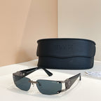 Blue-lens sunglasses with silver frame and black temple tips