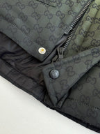 Charcoal GG-pattern hooded puffer jacket close-up of zipper and snap buttons
